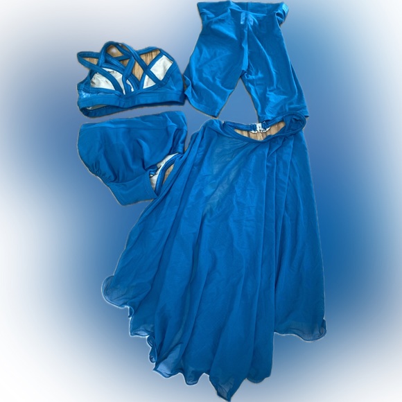 Details Dancewear 4 piece set
Strappy crop top, brief, sheer short, skirt - Picture 2 of 3